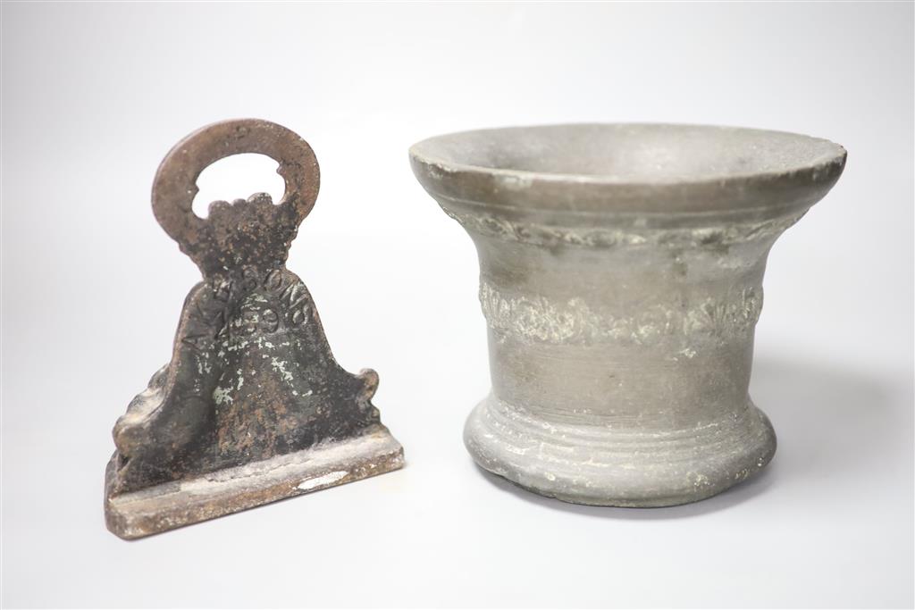 A 16th/17th century bronze mortar, height 16cm, and a cast iron doorstop